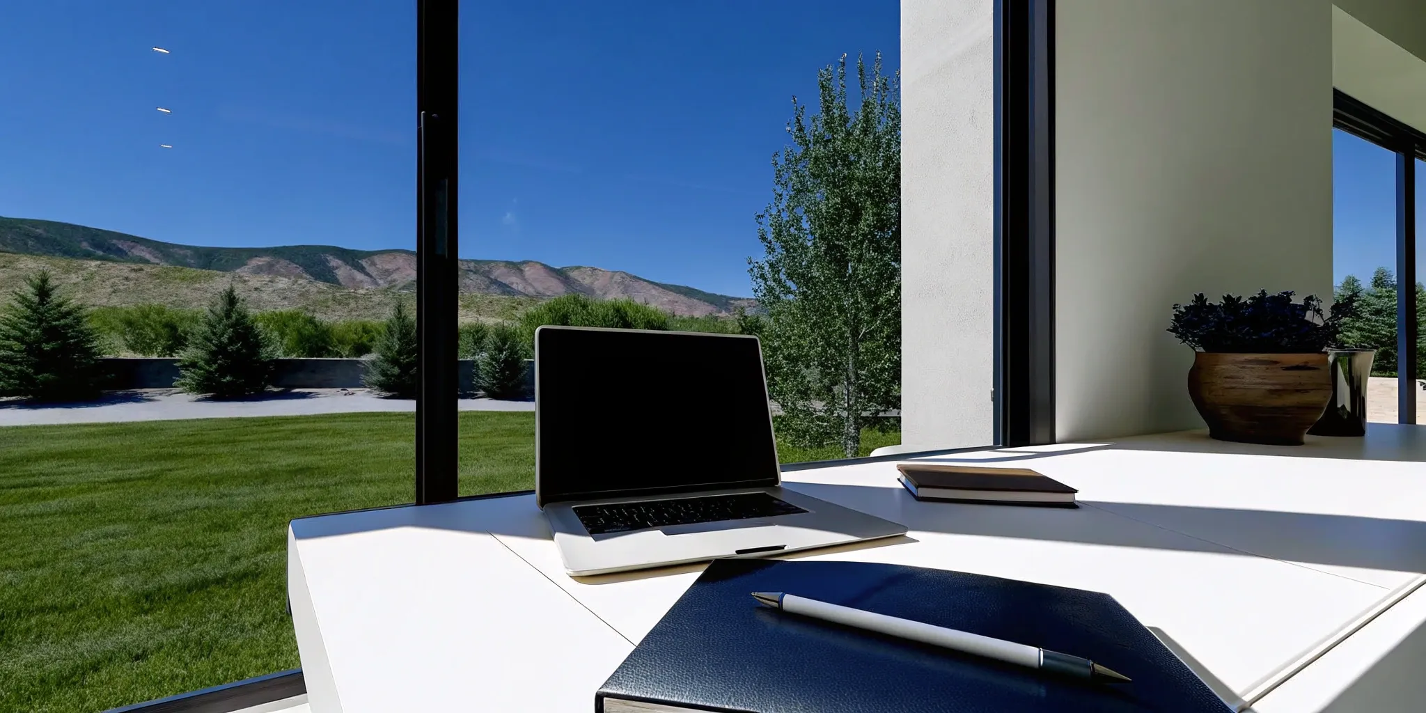 A self-employed person's desk with a laptop, researching how to qualify for a jumbo loan.