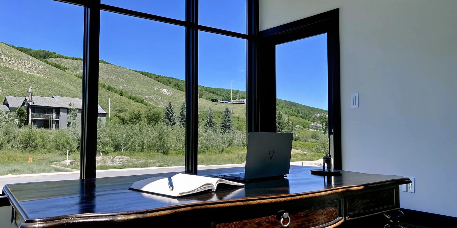 Planning a Park City home purchase with a mortgage calculator on a laptop.